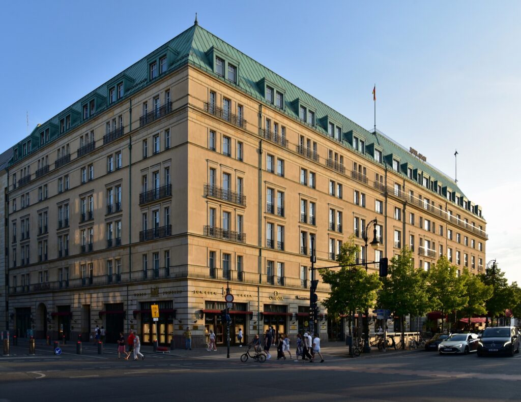 Hotel Adlon Kempinski in Berlin in late-afternoon sun under a blue sky