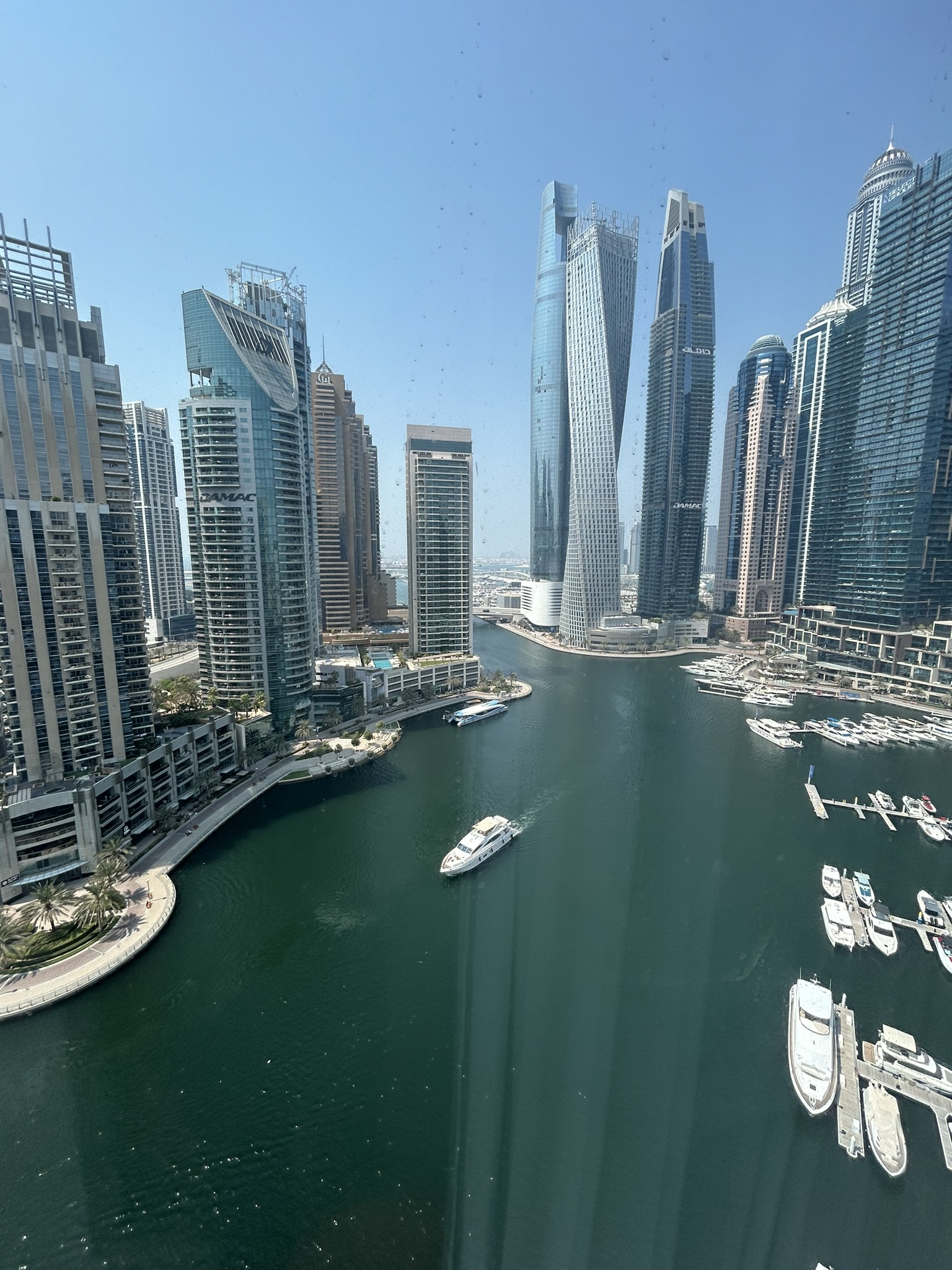 Towers along the Dubai Marina waterway seen from Jumeirah Beach Residence