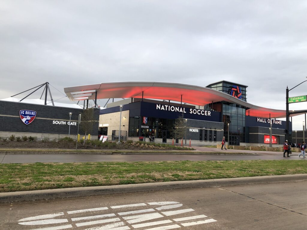 Toyota Stadium in Frisco, Texas, home of FC Dallas, with the National Soccer Hall of Fame entrance under an overcast sky