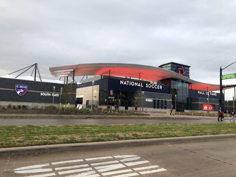 Toyota Stadium in Frisco, Texas, home of FC Dallas, with the National Soccer Hall of Fame entrance under an overcast sky