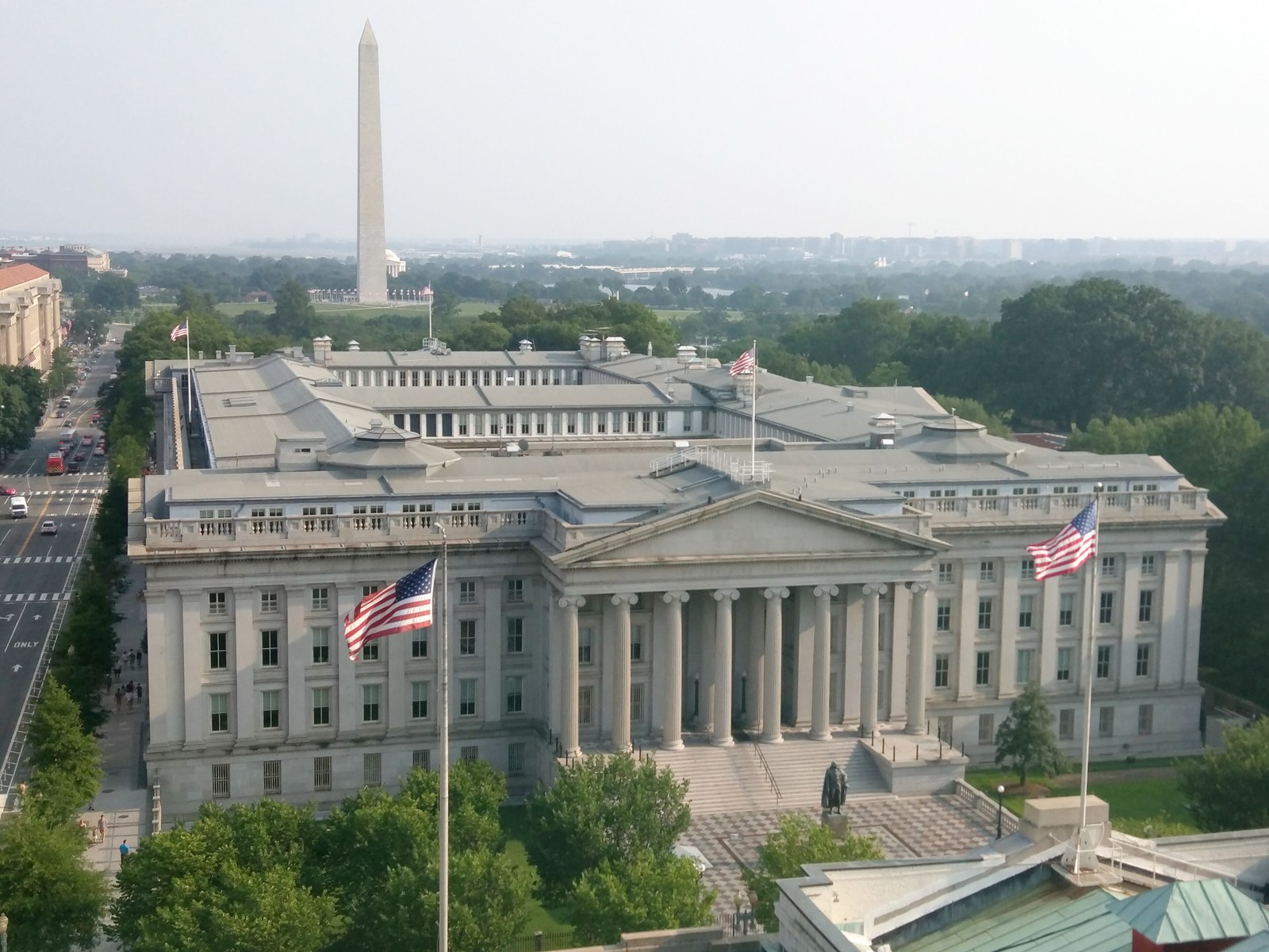 U.S. Treasury Building in Washington, D.C., with the Washington Monument behind it