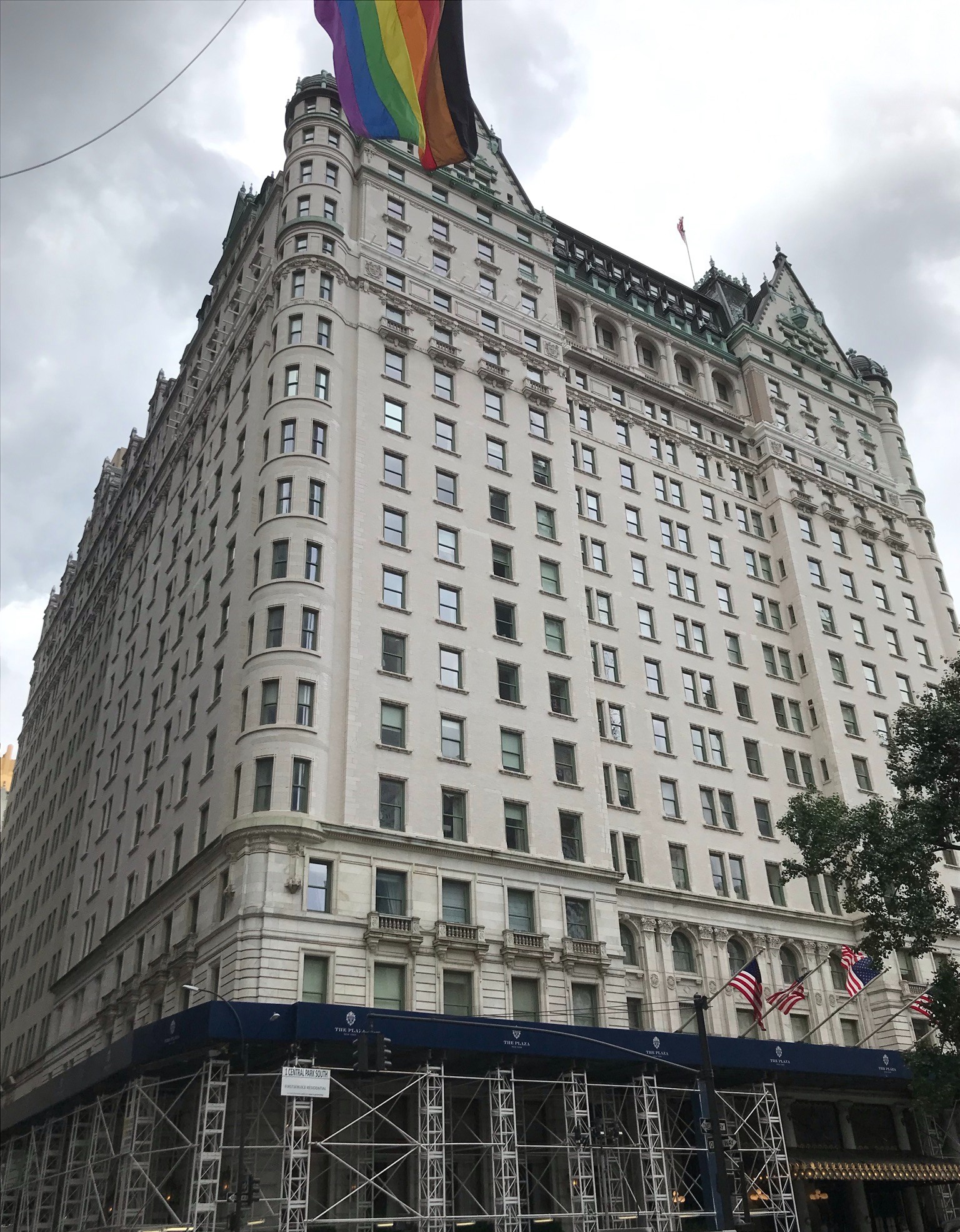 Exterior of The Plaza Hotel, New York, June 2022, with flags flying above the entrance