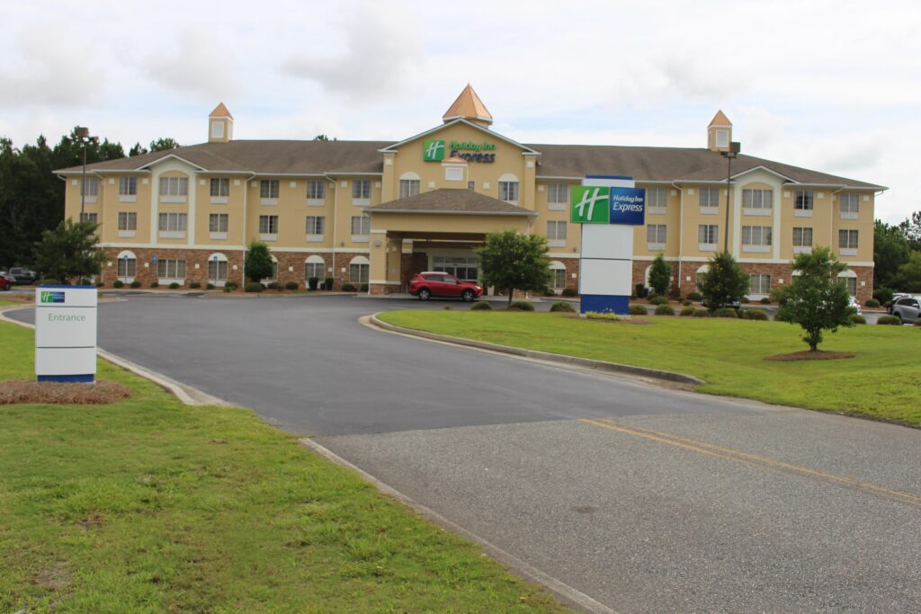 Holiday Inn Express near the Savannah airport, with lawn and entry drive