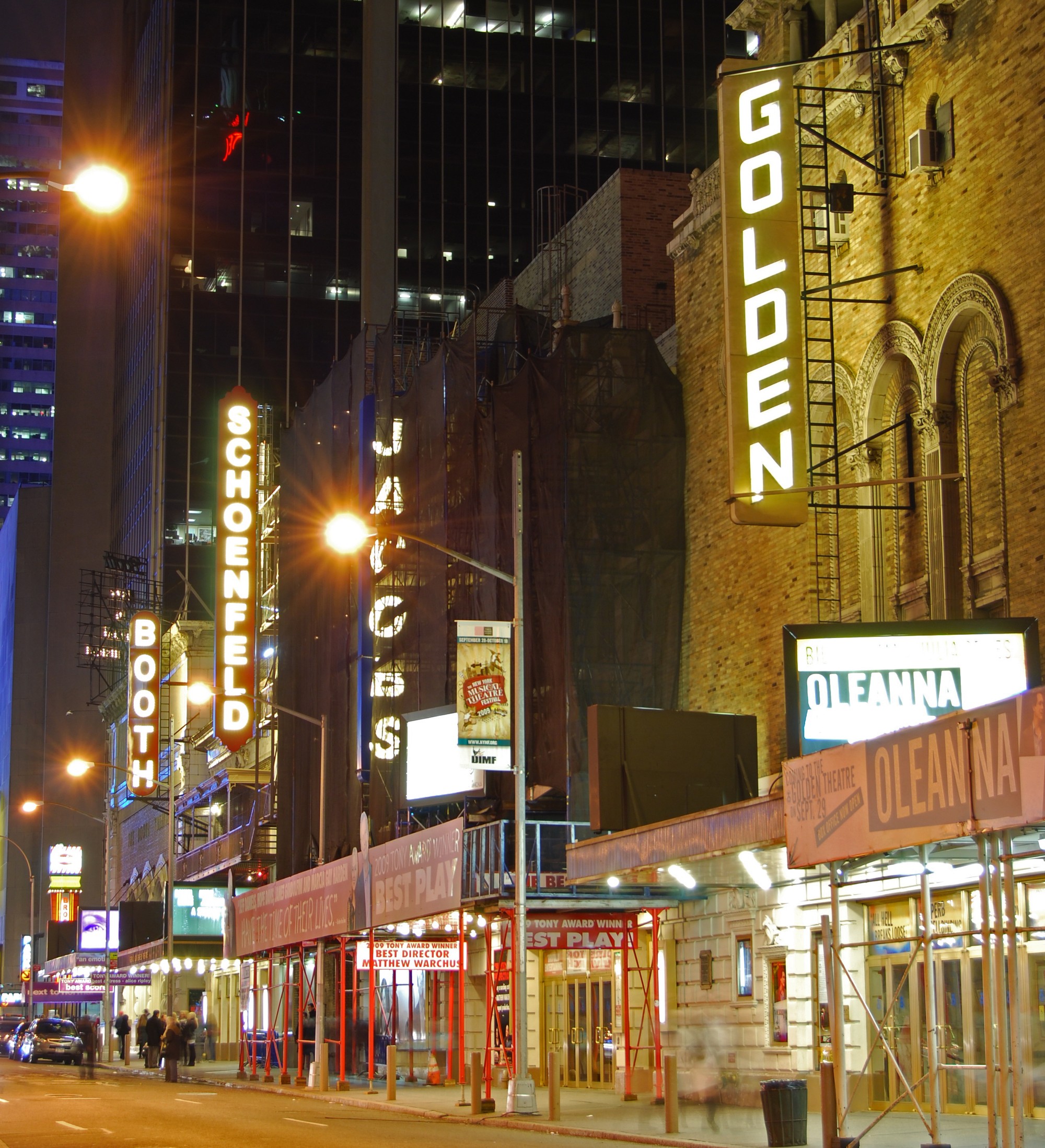 Broadway theater marquees glowing at night on West 45th Street, Manhattan